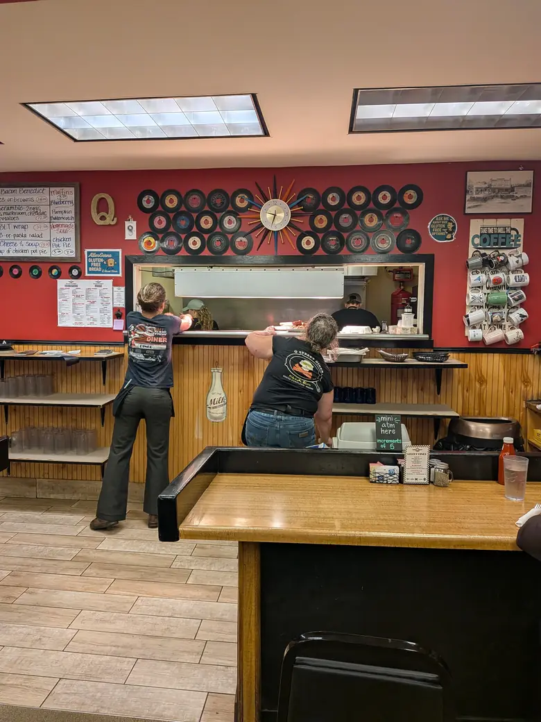 Interior of a small diner in South Portland, Maine, with a person at the counter