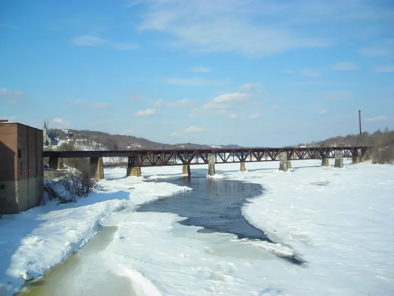 The icy Kennebec River and a bridge at Augusta, Maine, in winter