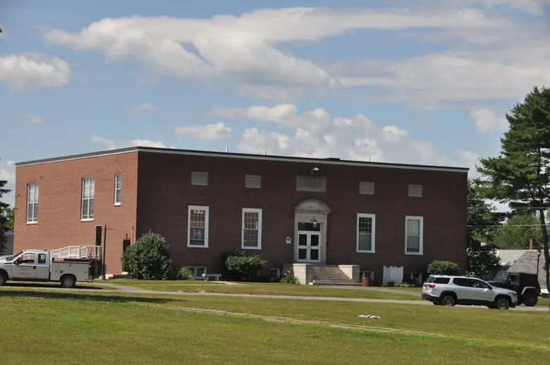 A flat-roofed brick building on the Maine Central Institute campus in Pittsfield
